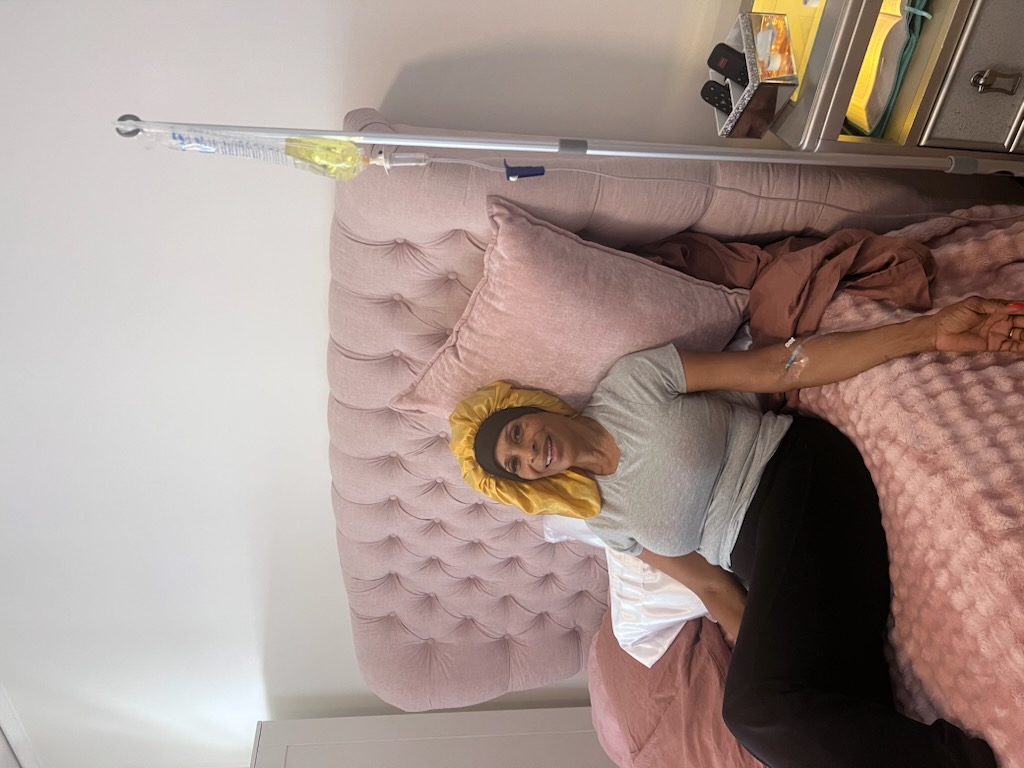 Client receiving a Revive Wellness IV drip at home in Los Angeles